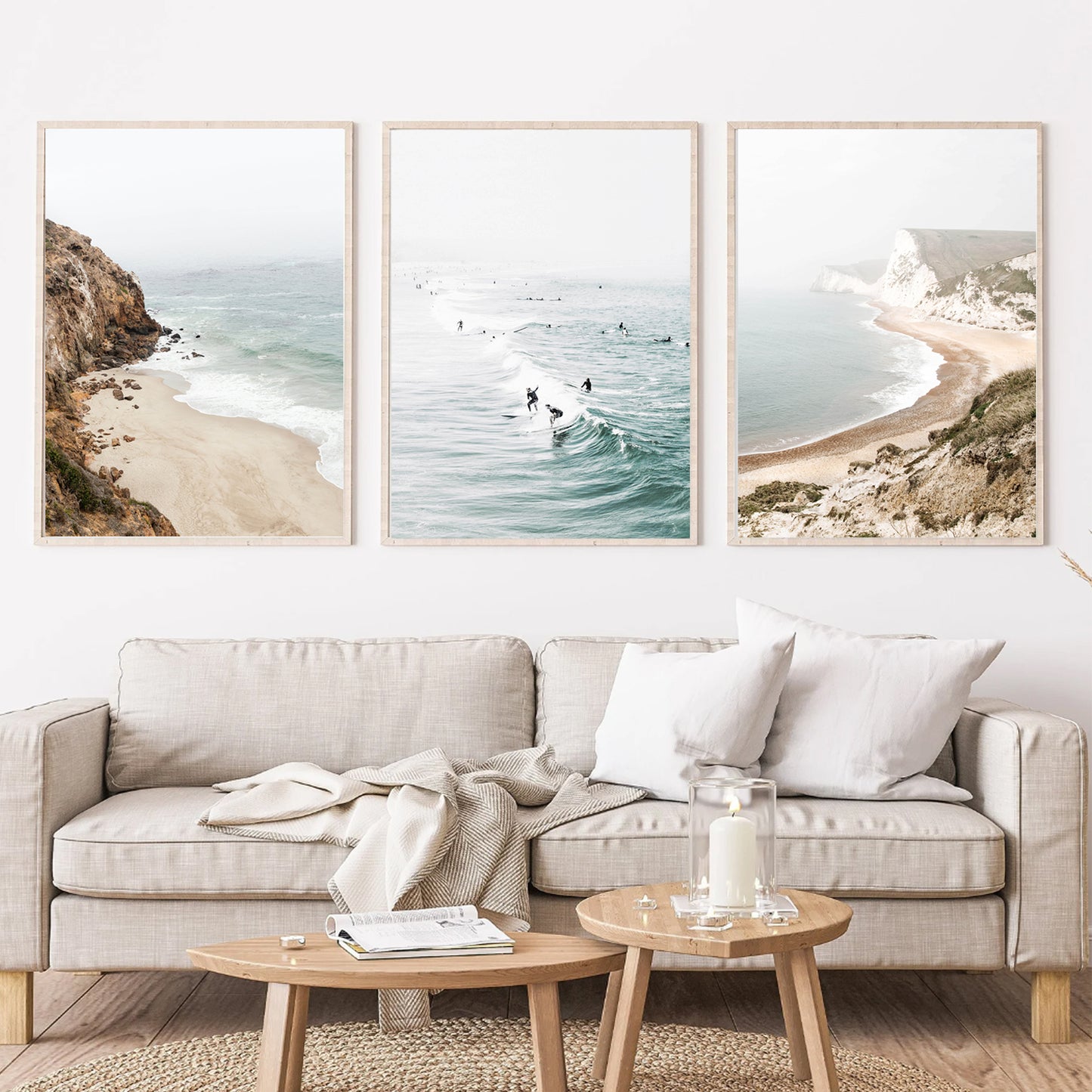 Coastal 3 piece wall art in light interior above the sofa.
