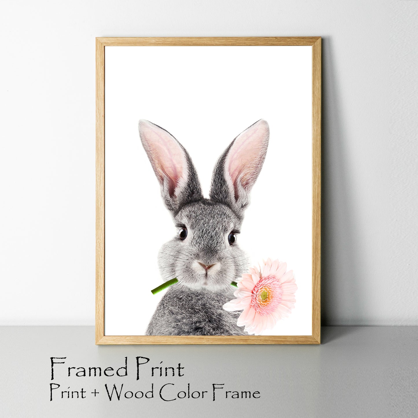 Bunny with pink flower print in wood color frame.