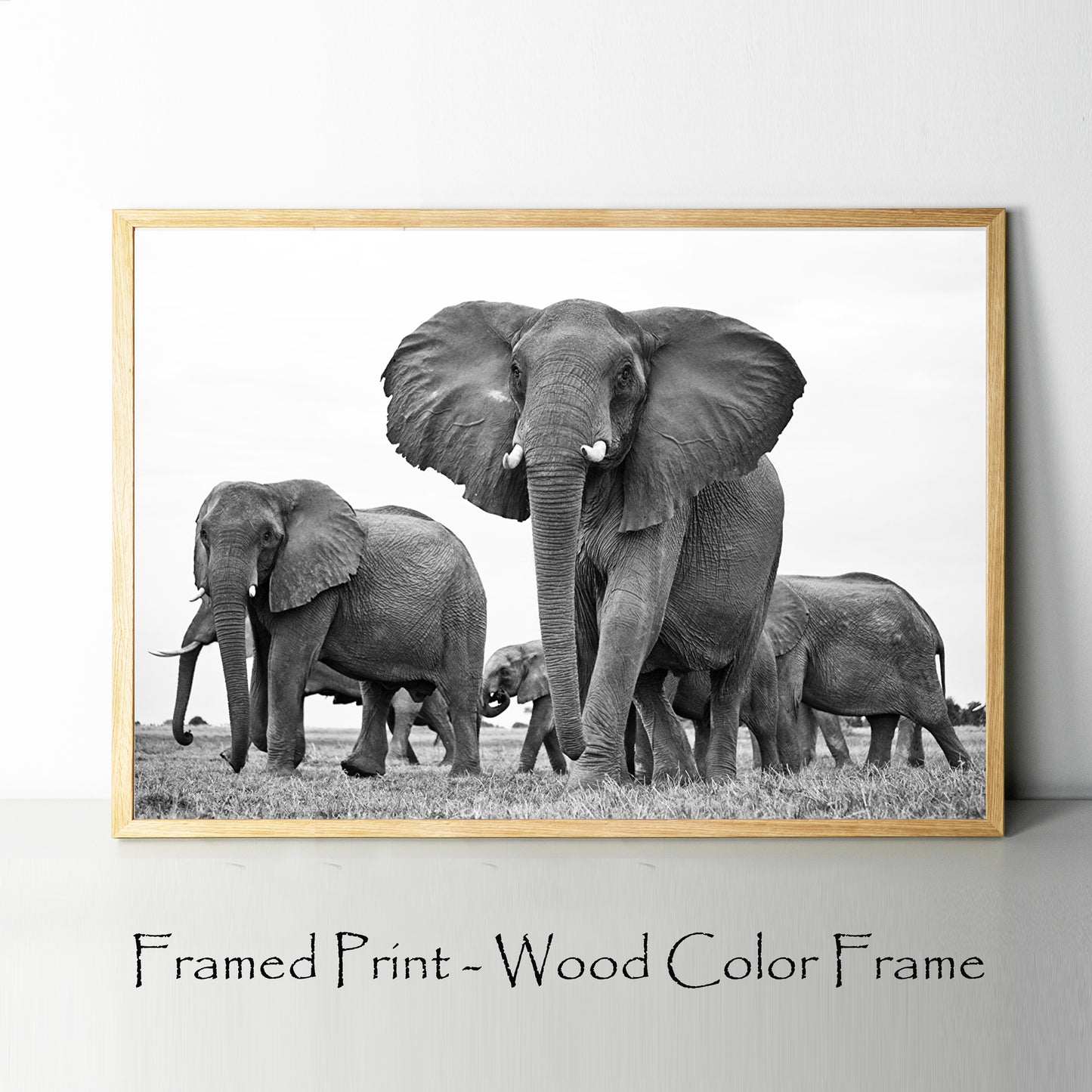 Elephants print in wood color frame.