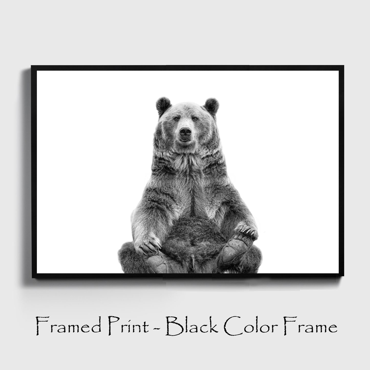 Sitting bear poster in black color frame.