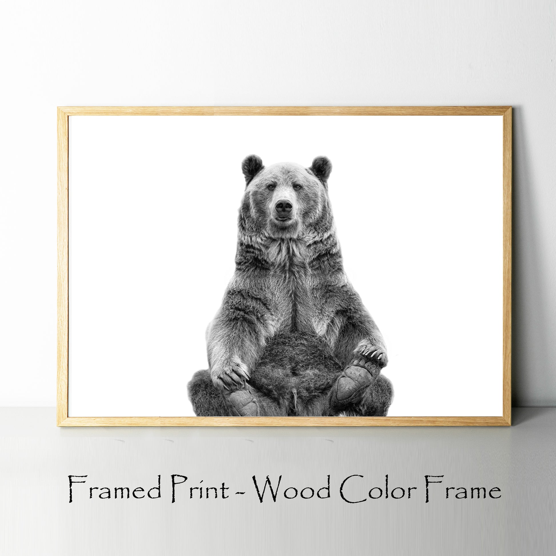 Sitting bear poster in wood color frame.