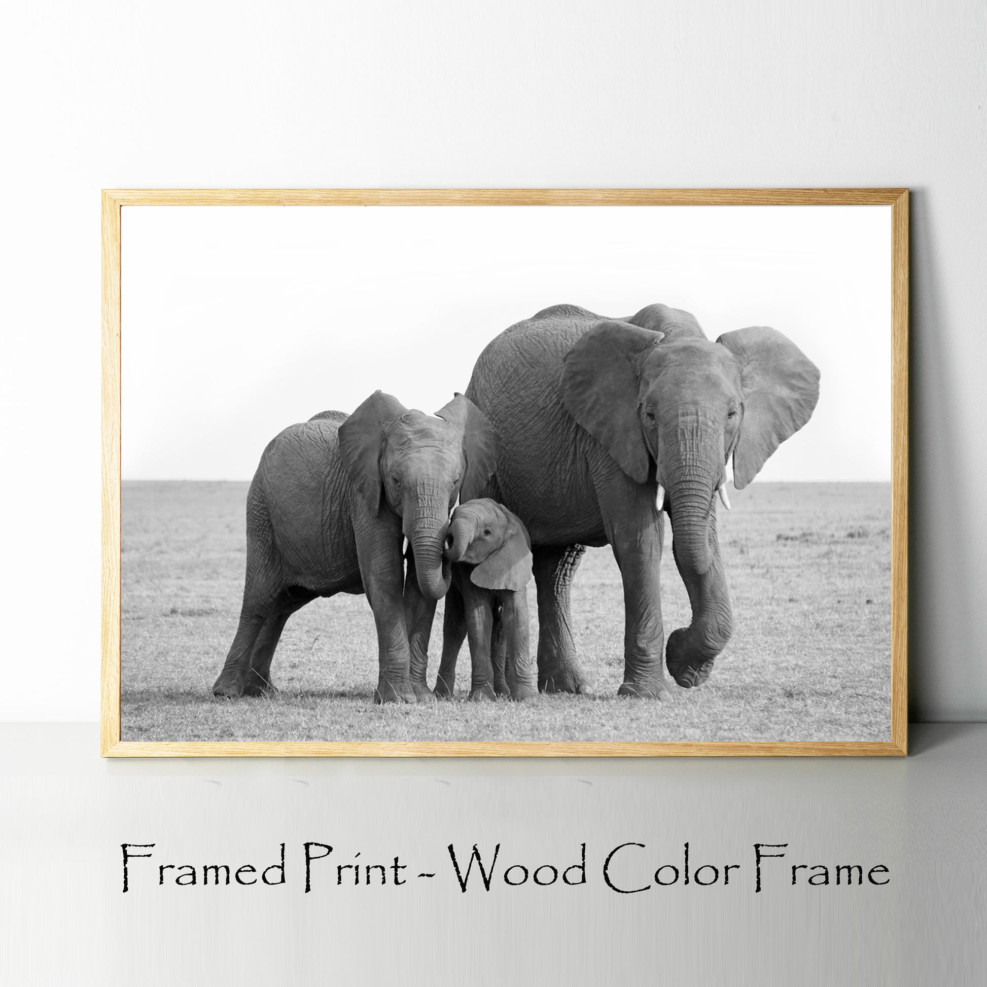 Elephants print in wood color frame.