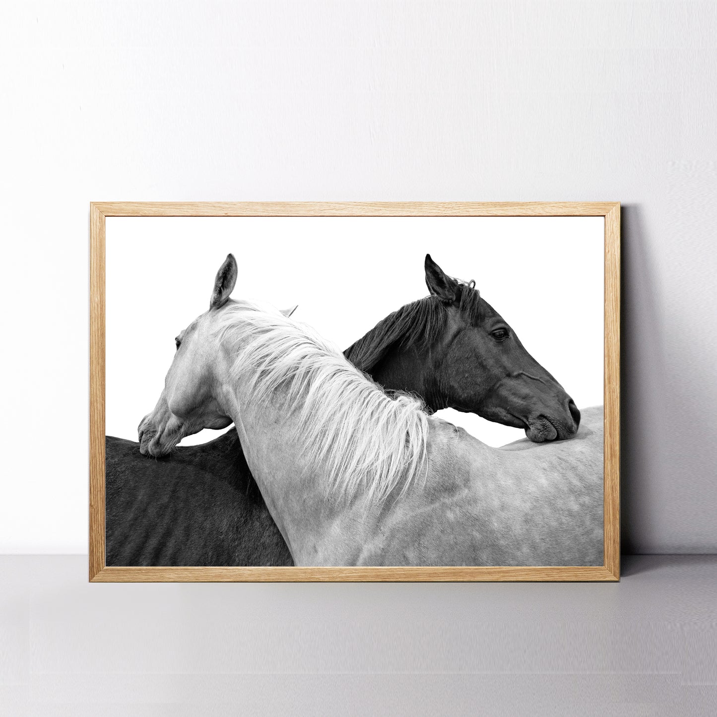 Two horse wall art in black and white.