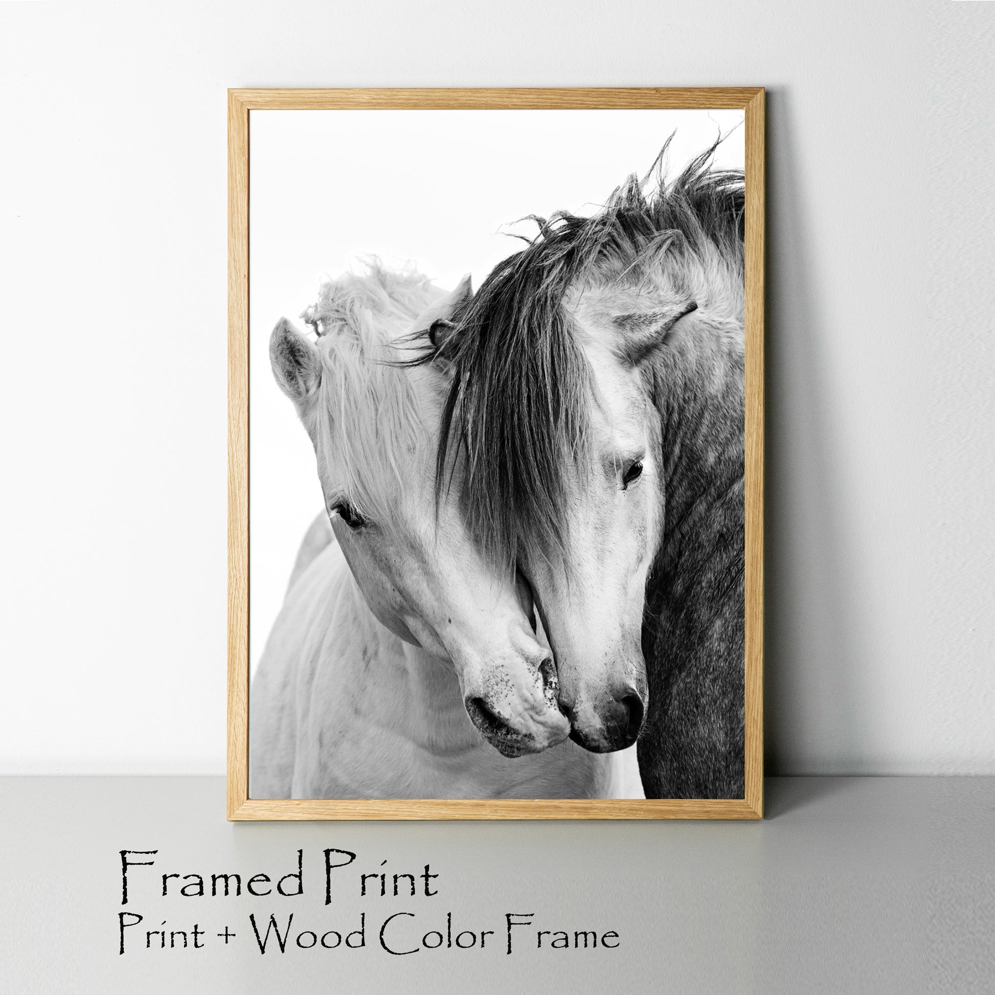 Two kissing horses print with wood color frame.