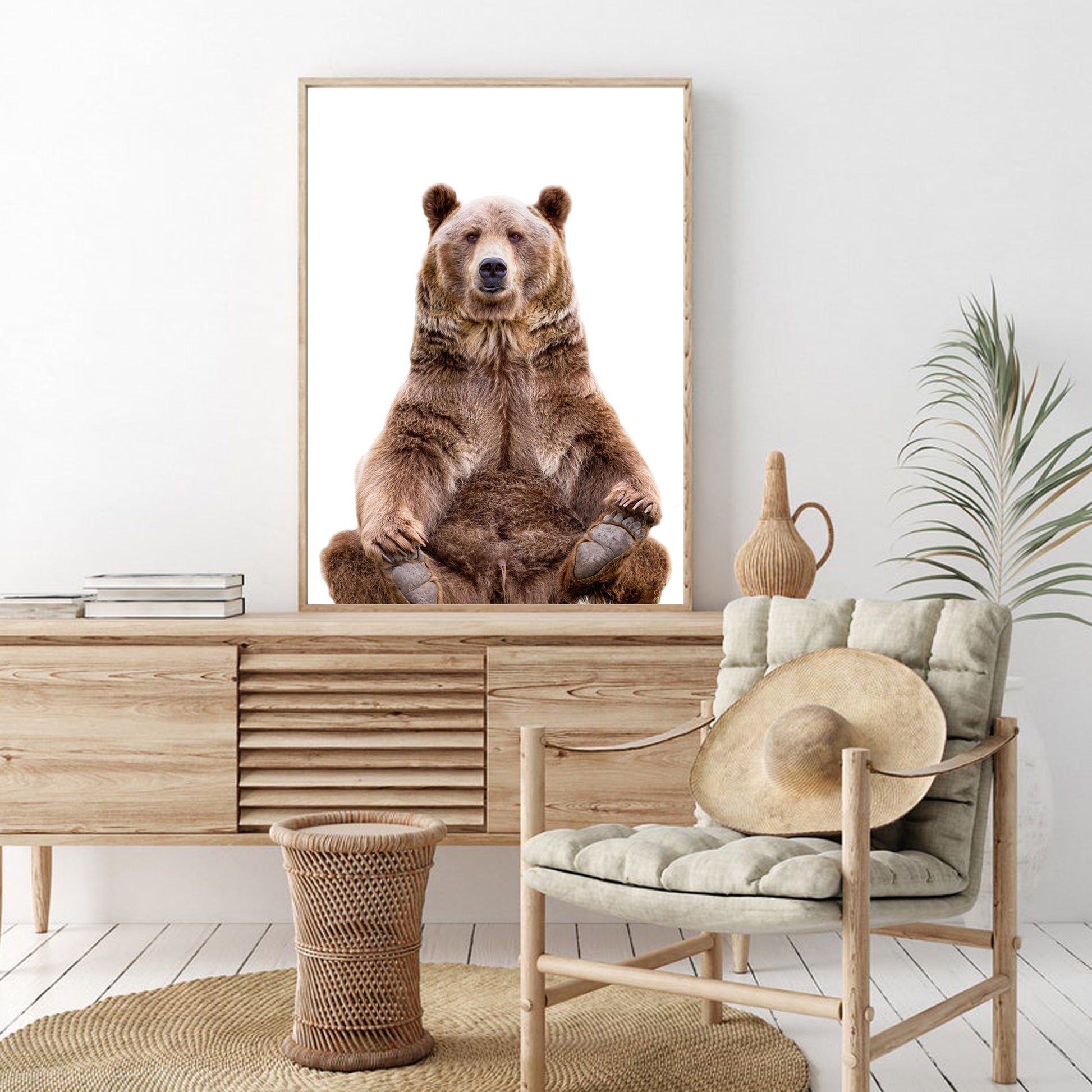 Sitting bear colorful photo in wood color frame 60x90 cm hanging on the wall in the living room.