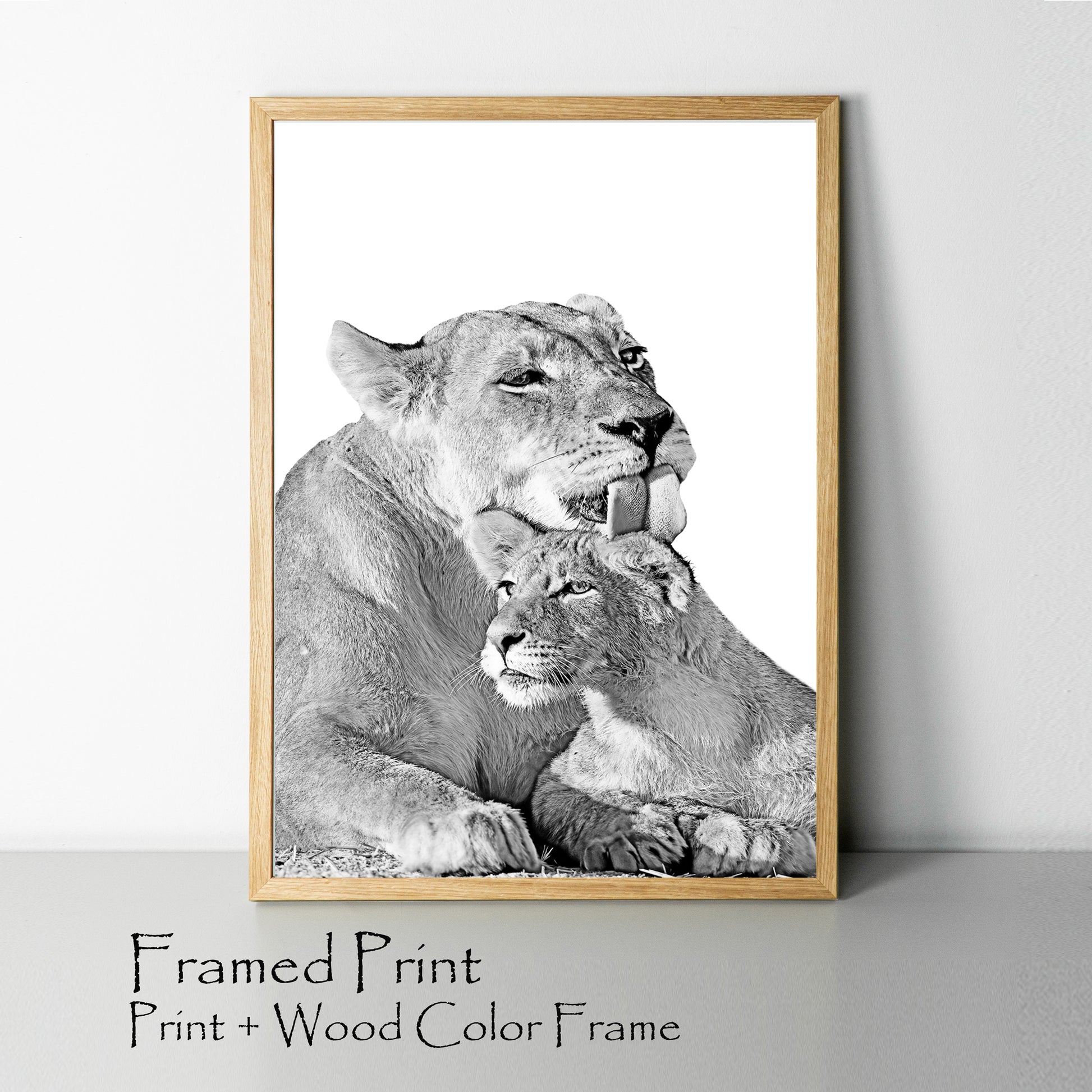 Lioness and lion cub print in wood color frame.