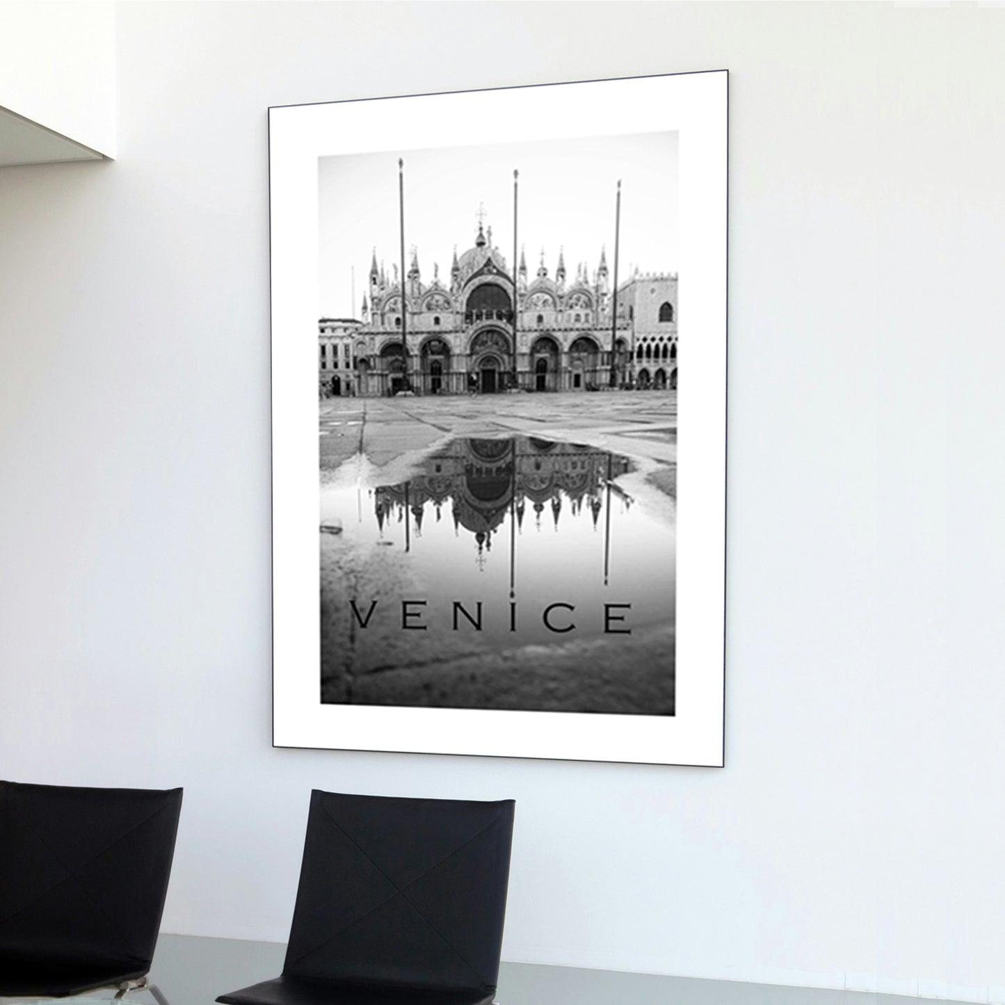 Venice poster on white wall.