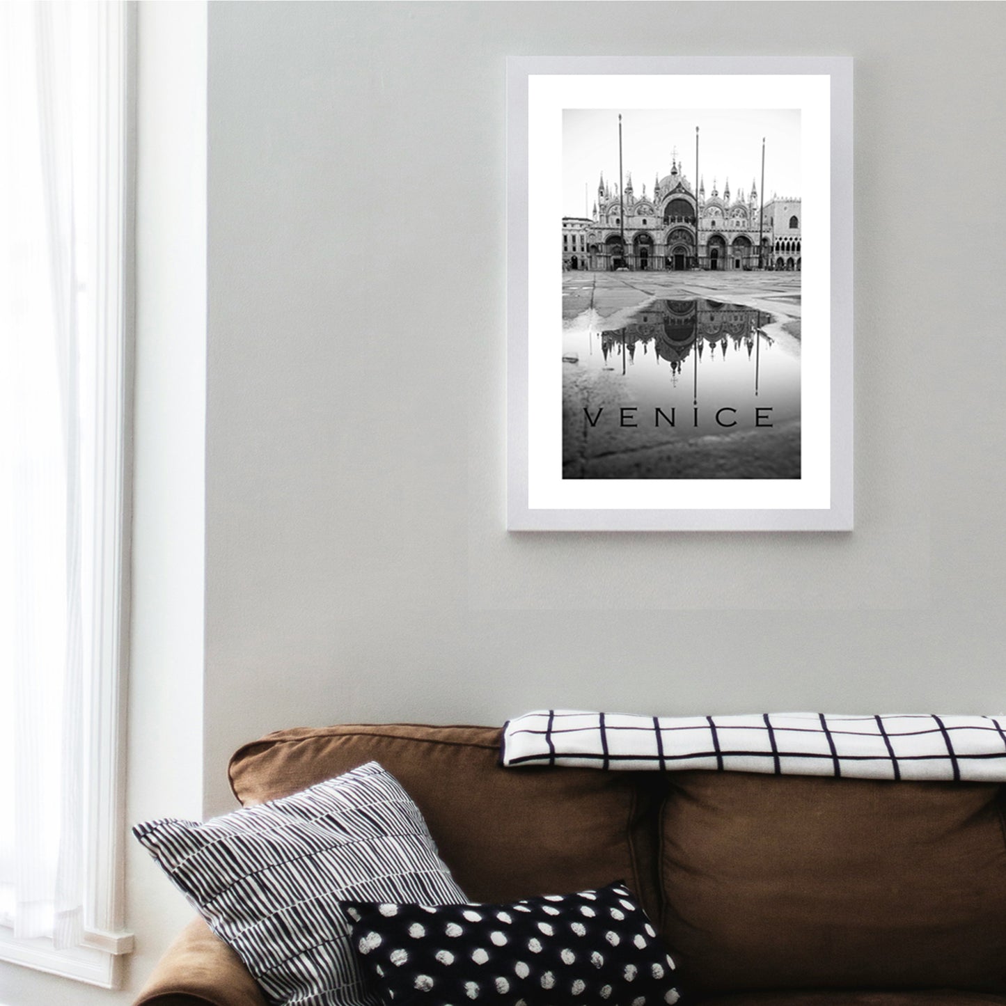 Venice poster in white color frame.