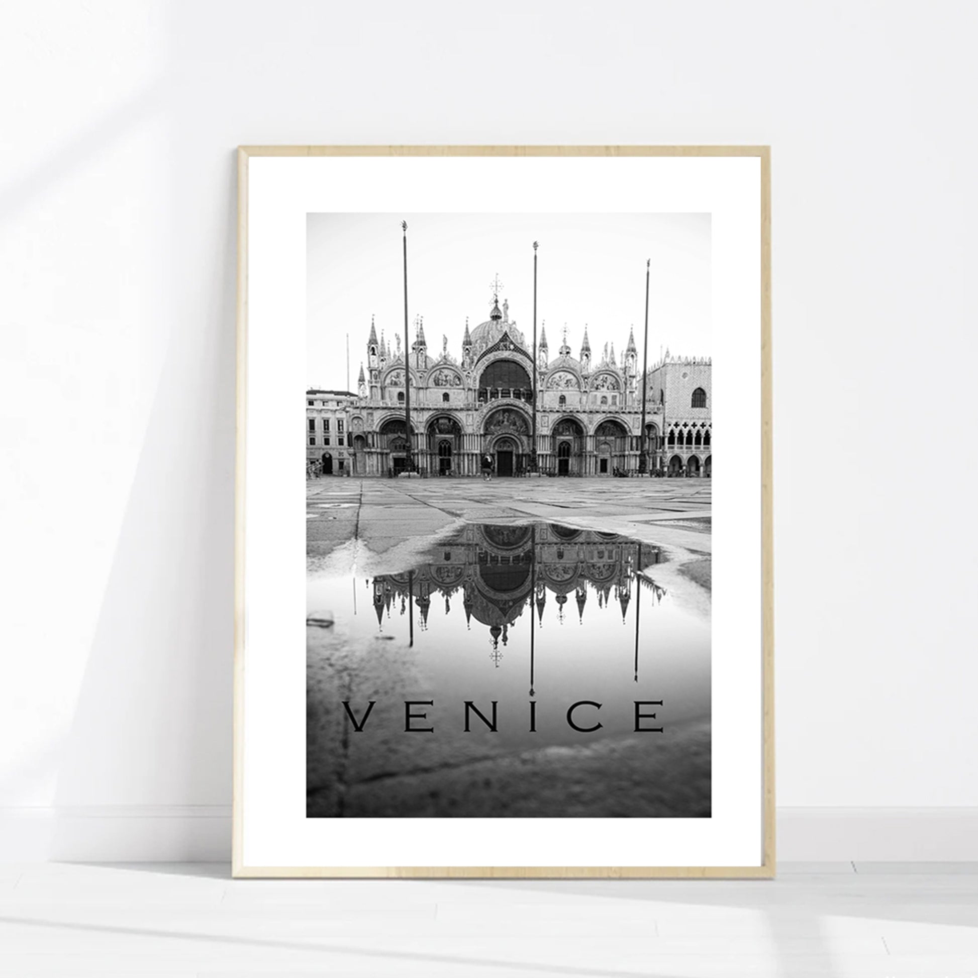 Venice Italy poster in wood color frame.