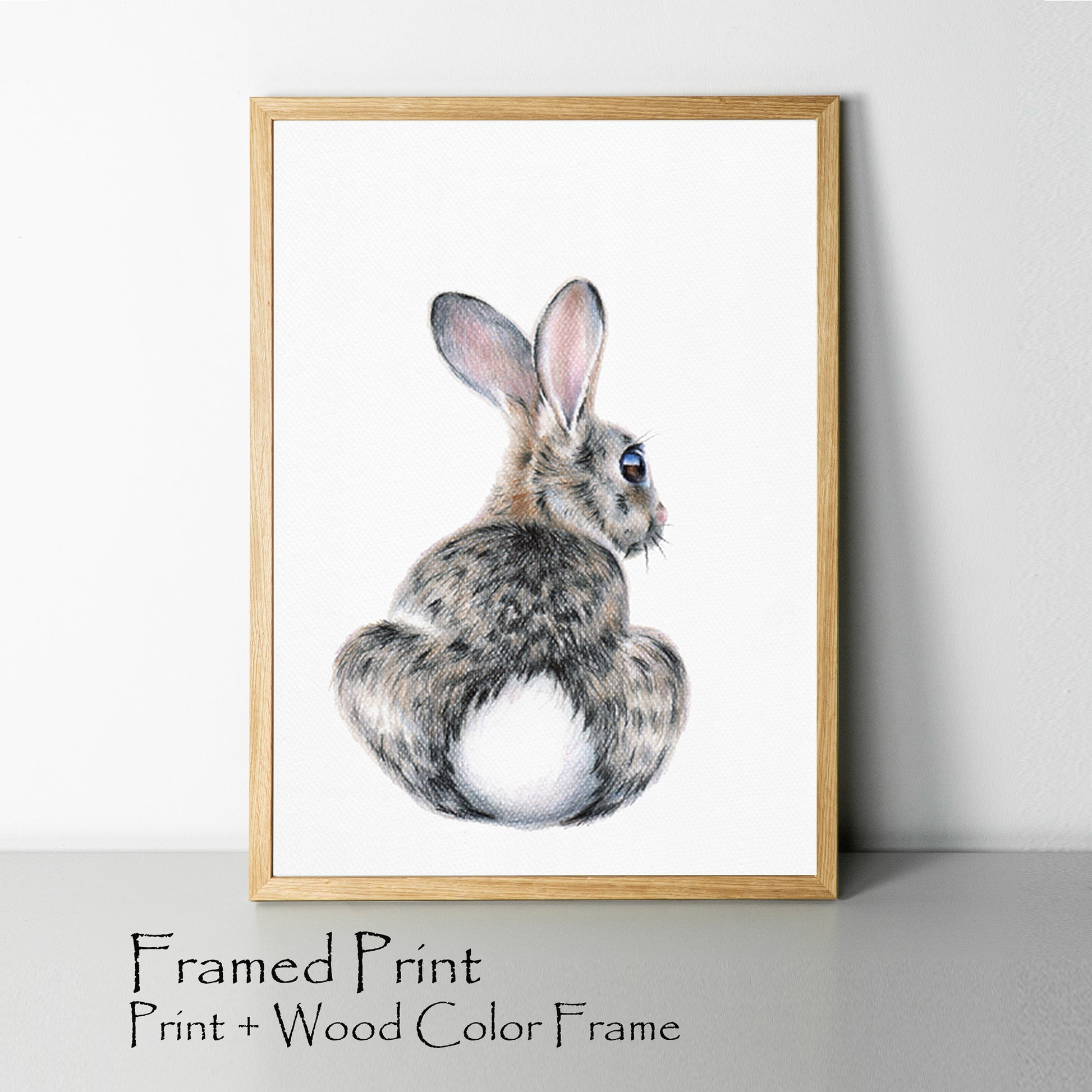 Bunny drawing print in wood color frame.