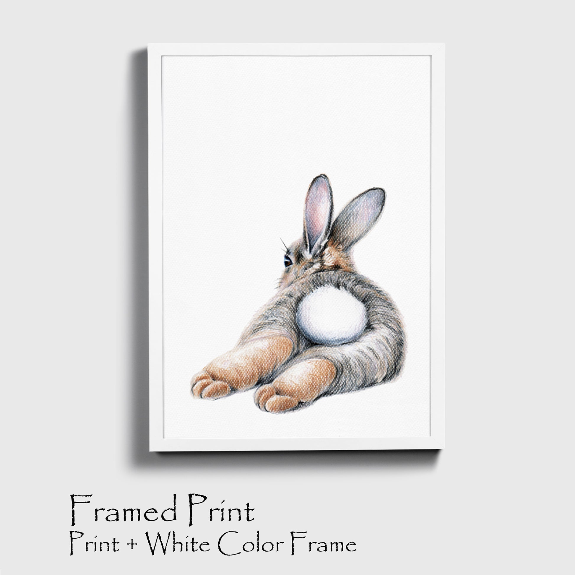 Bunny wall art in white color frame.