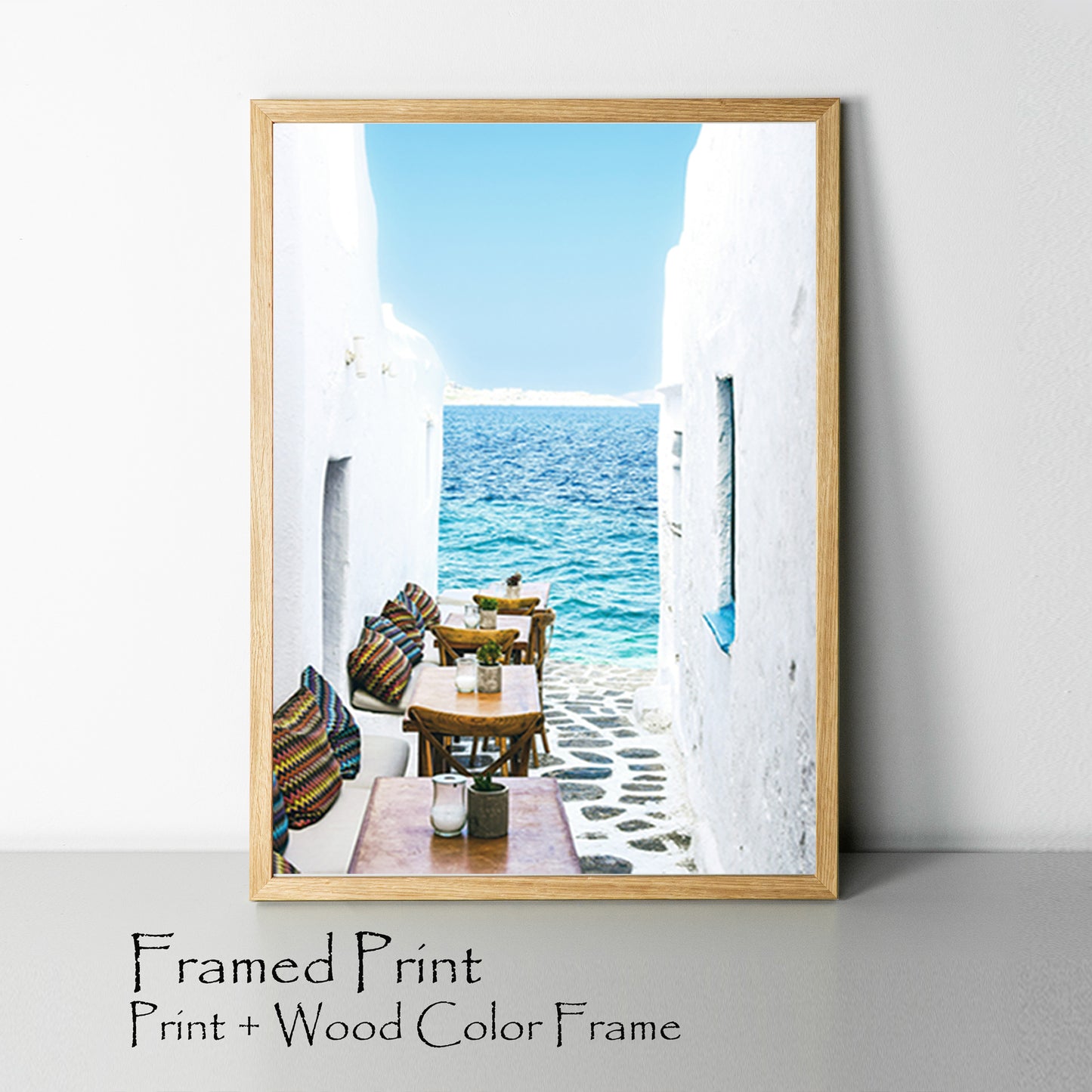 Greek tavern with sea view framed print.