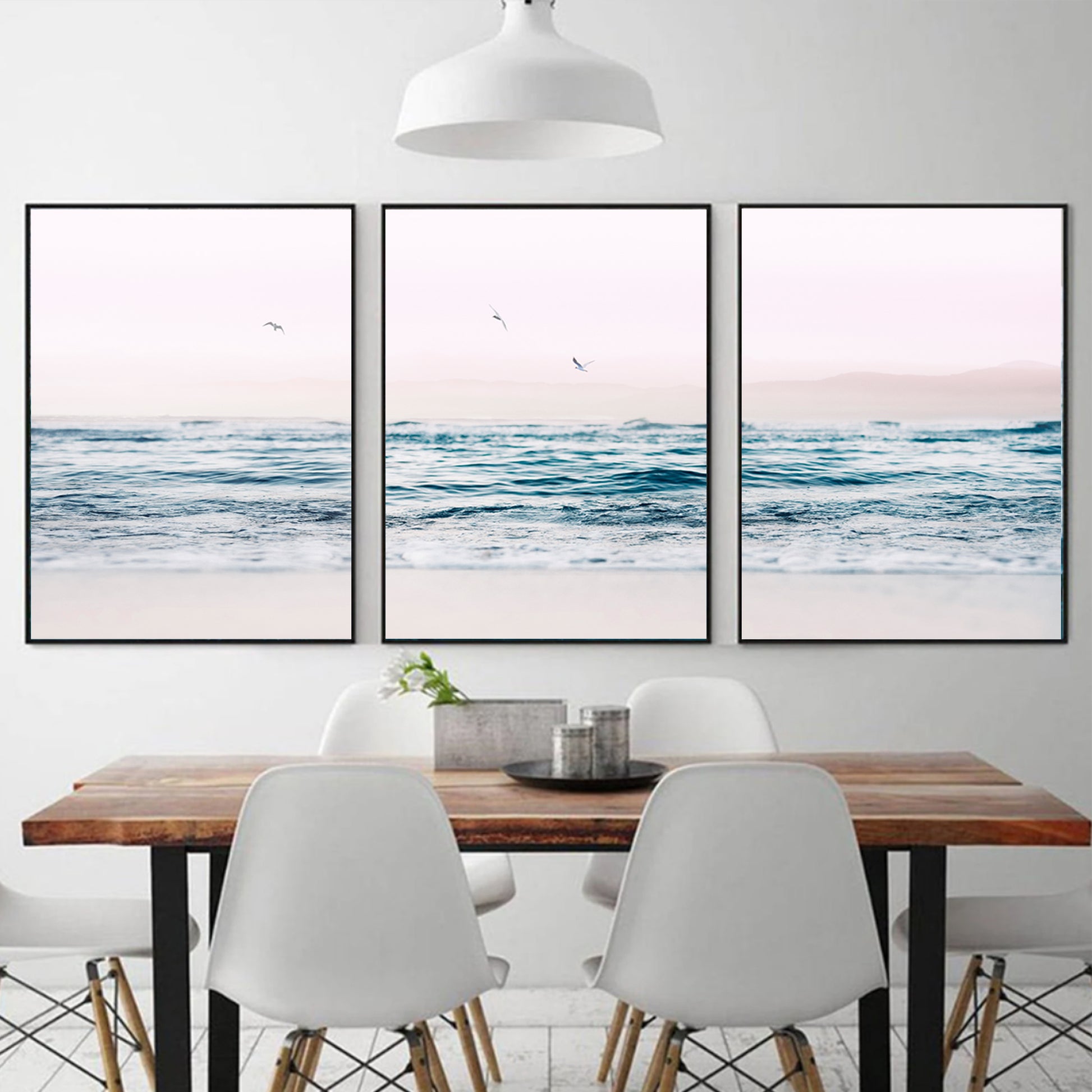 Ocean and gulls wall art in black color frames.