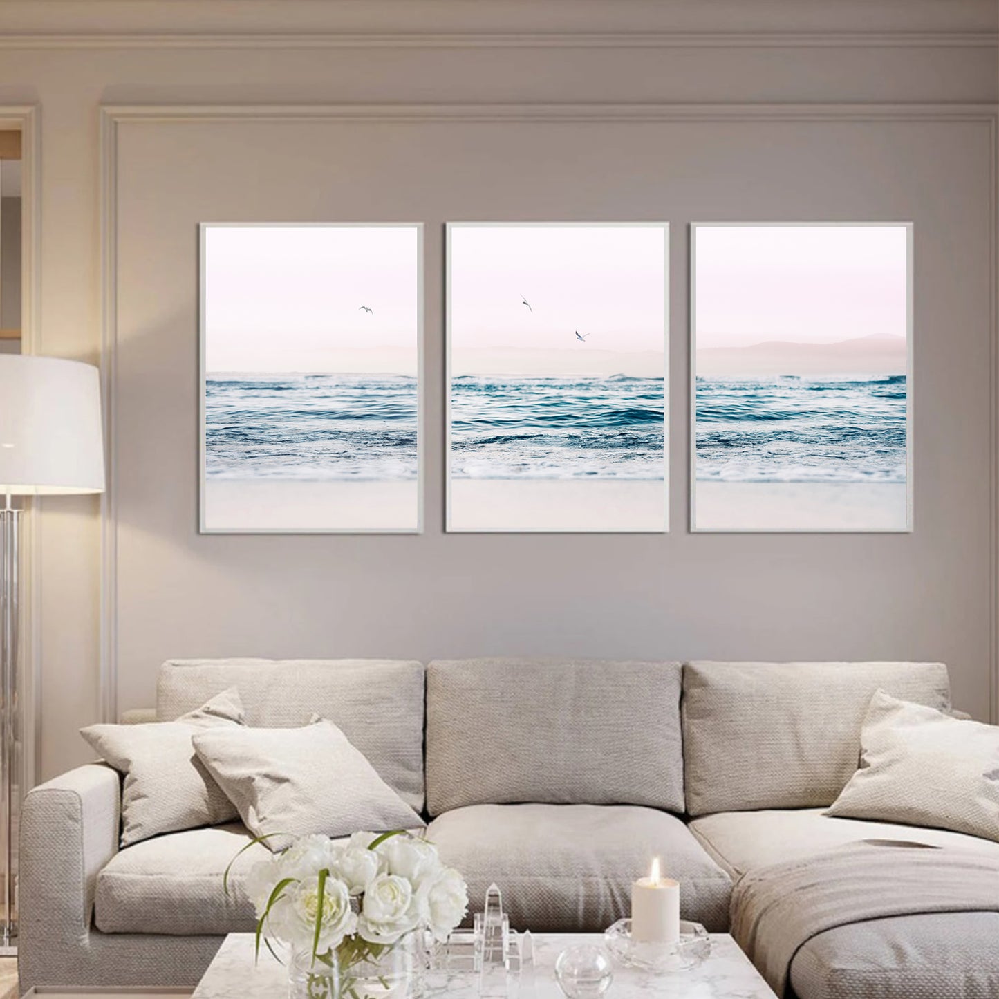 Ocean and seagulls wall art in white color frames.