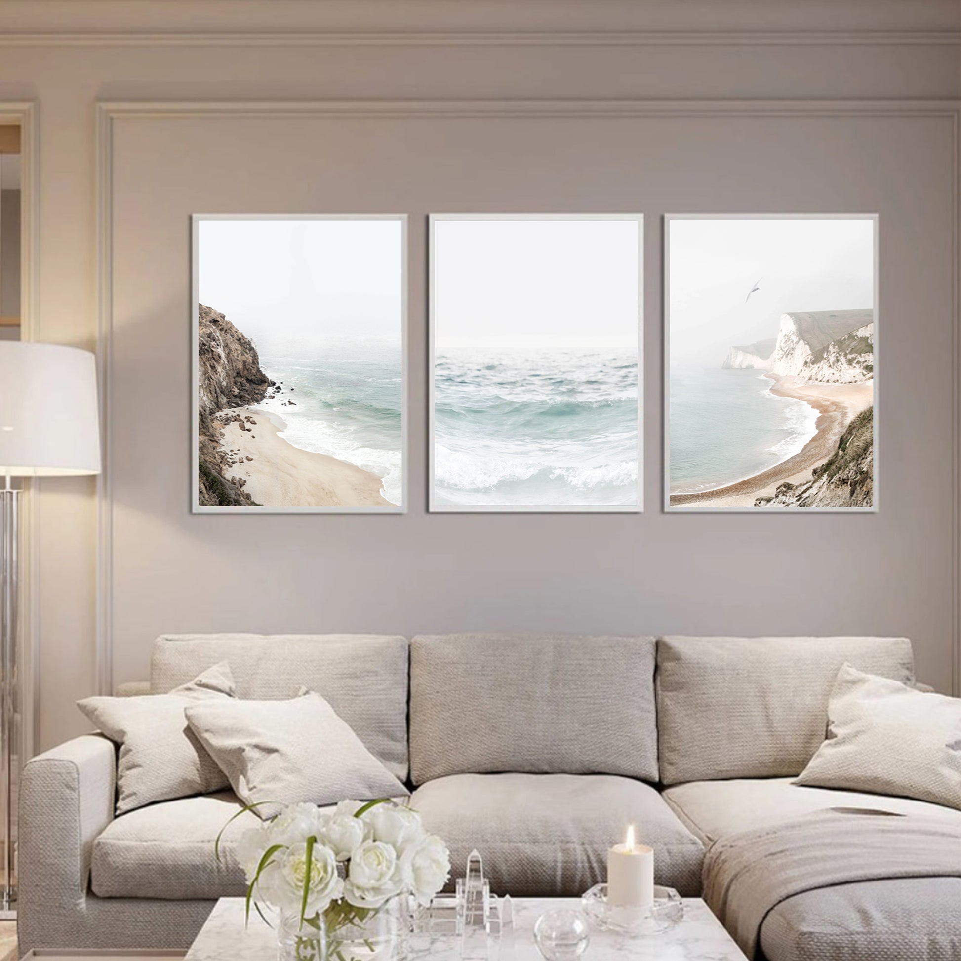 Coastal triptych in a light colored living room.