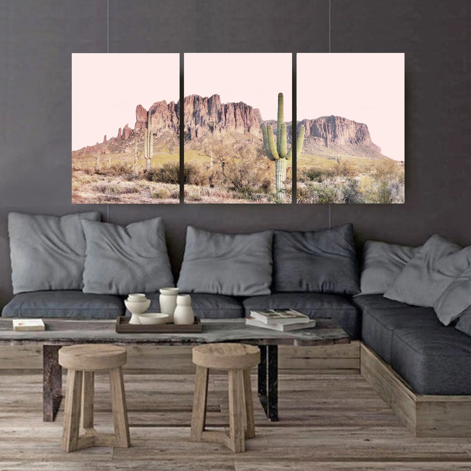 Desert landscape canvas triptych on dark wall.