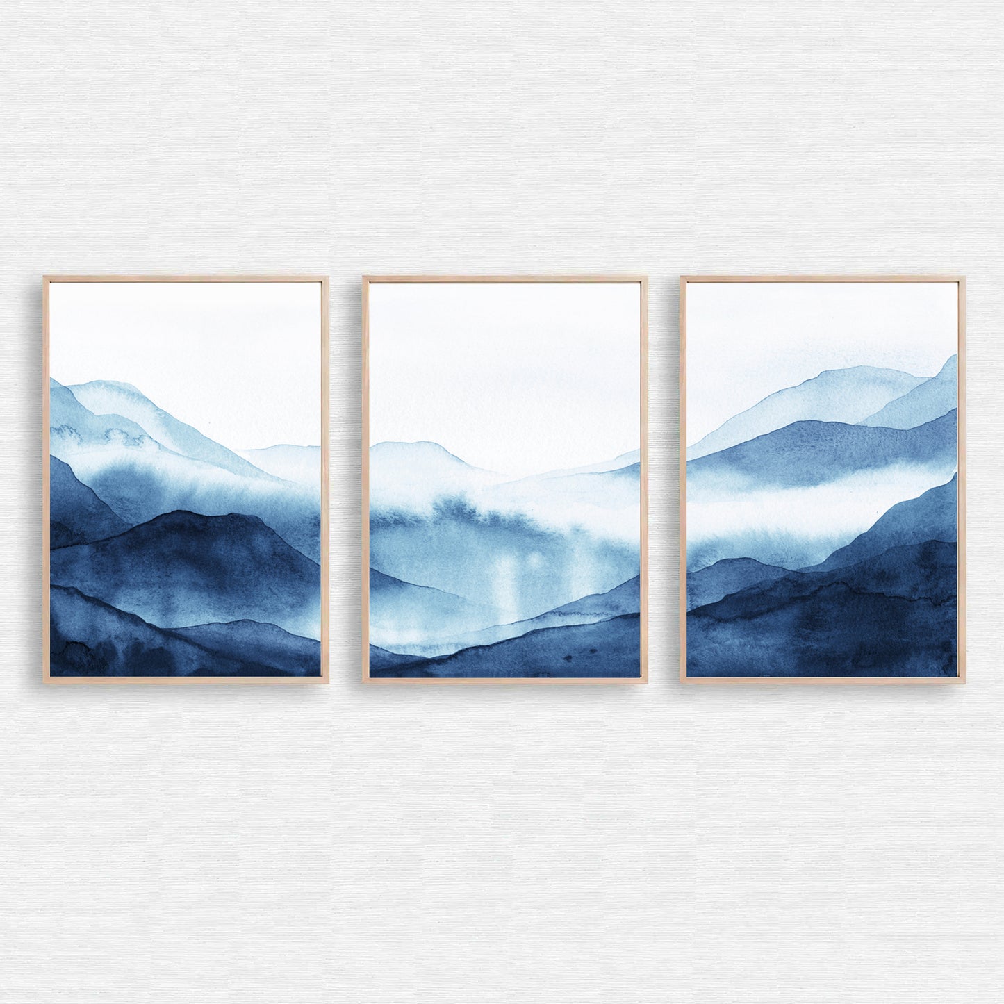 Dark blue watercolor art with foggy mountains.