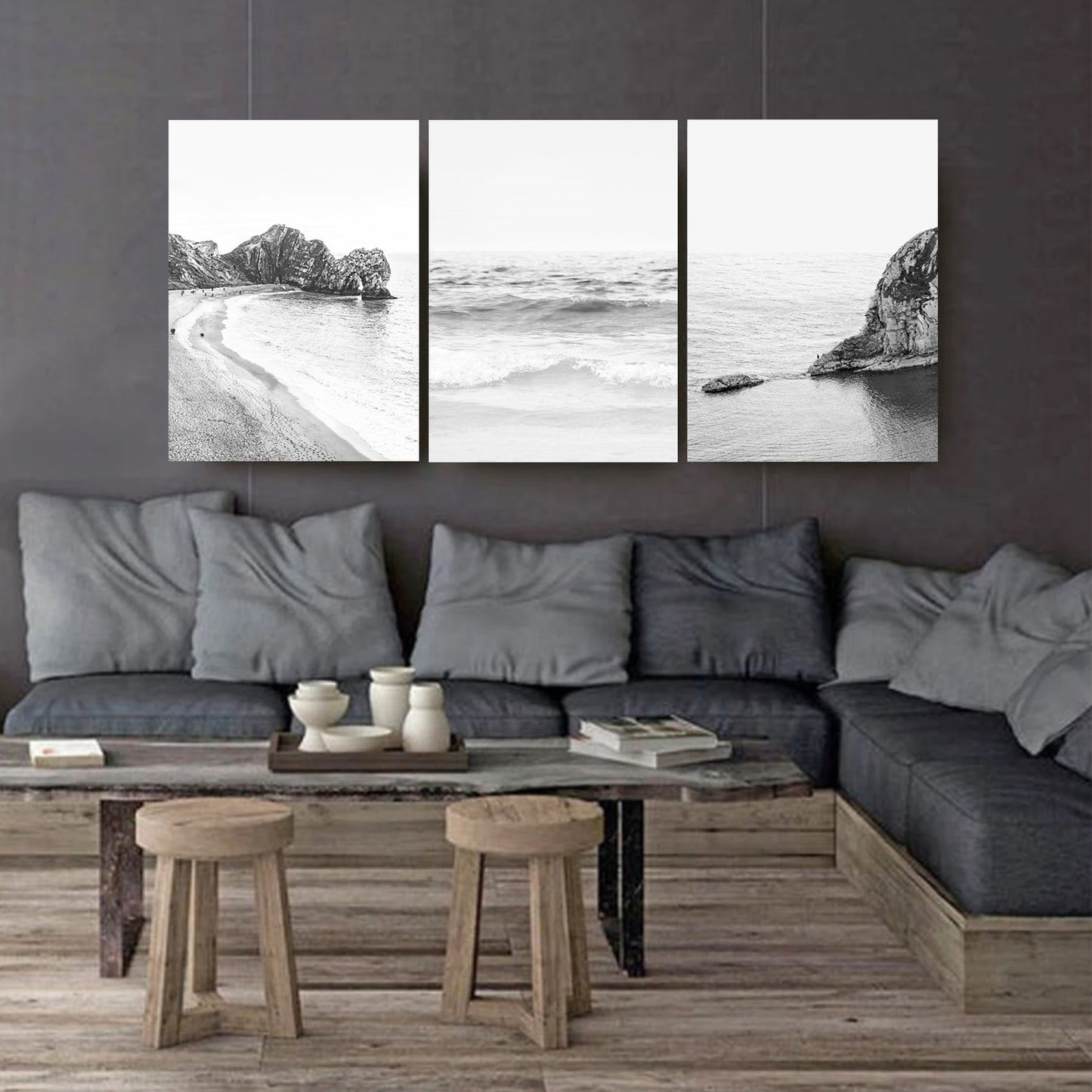 Coastal landscapes canvas triptych on dark wall.