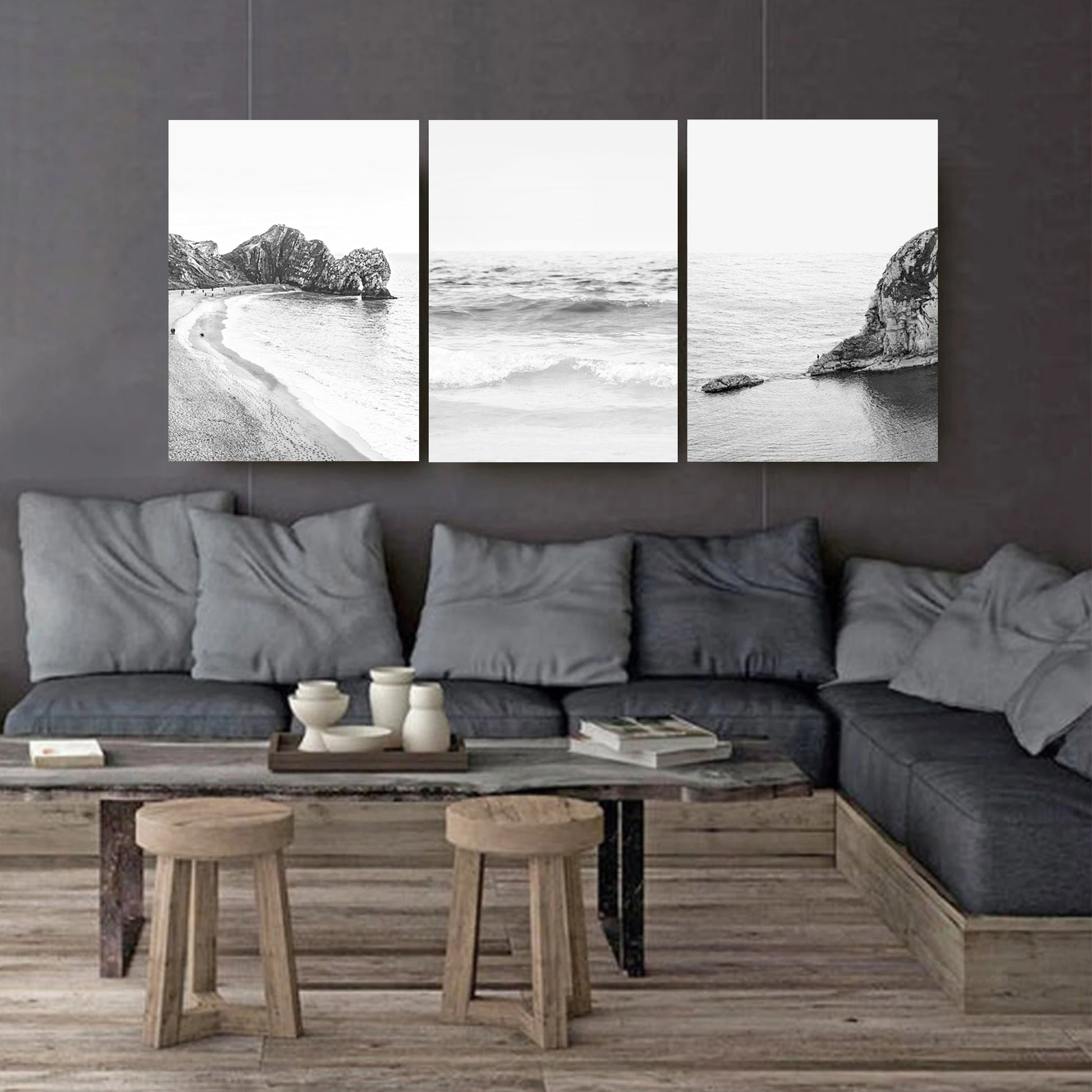 Coastal landscapes canvas triptych on dark wall.