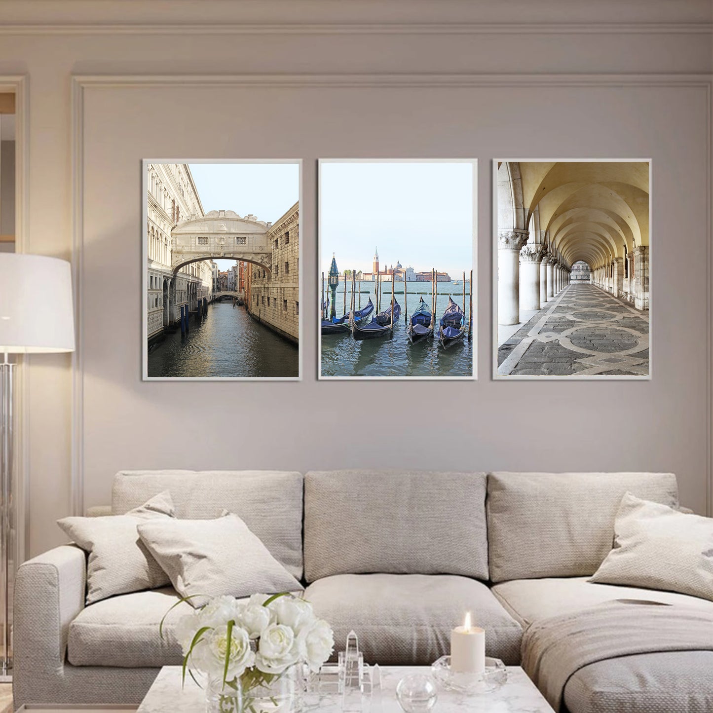 Venice triptych 50x70 cm in white color frames above the sofa.