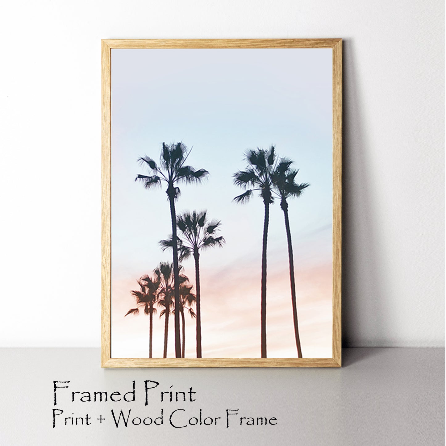 Palm trees on sunrise framed print.