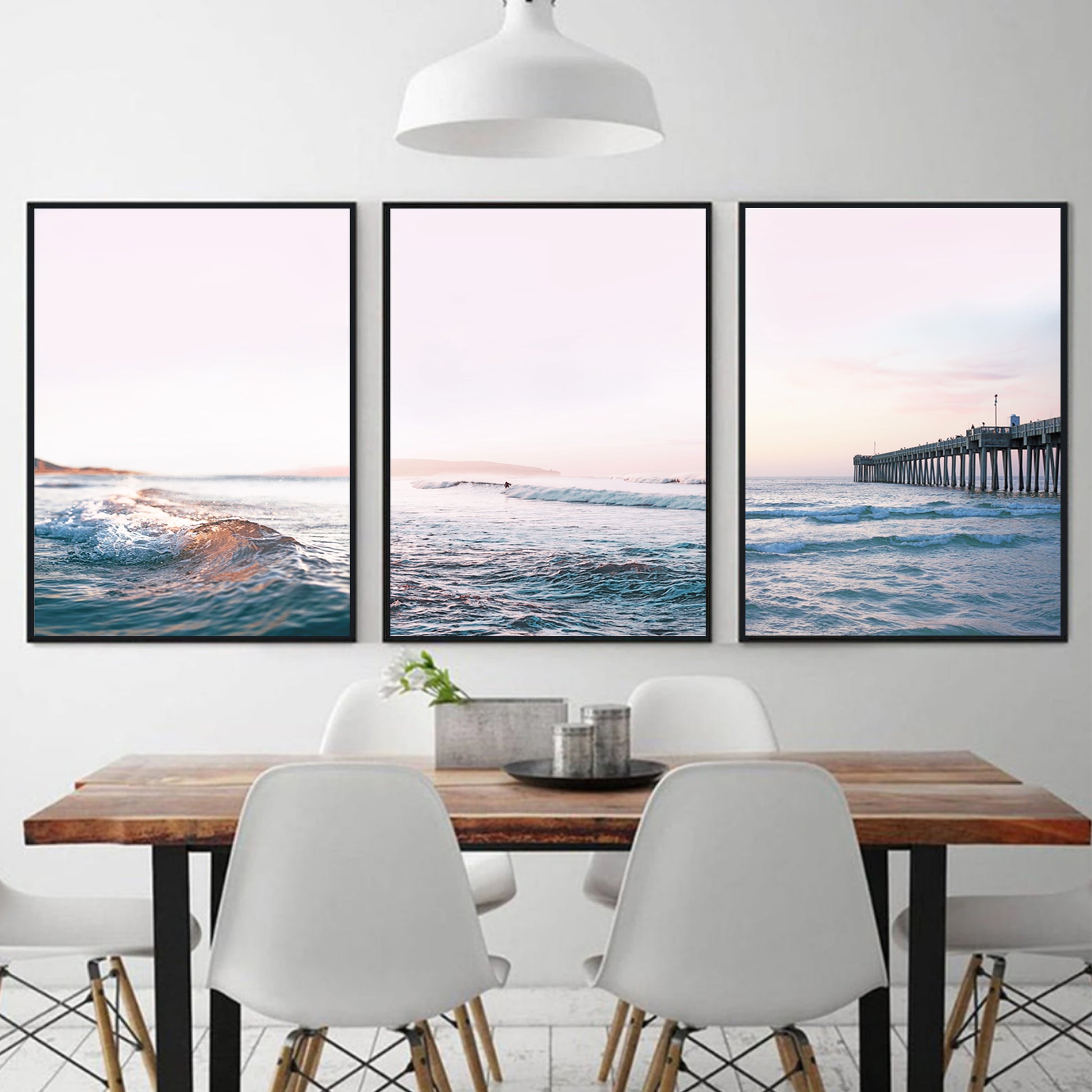 Ocean sunset triptych on satin paper in black color frames.