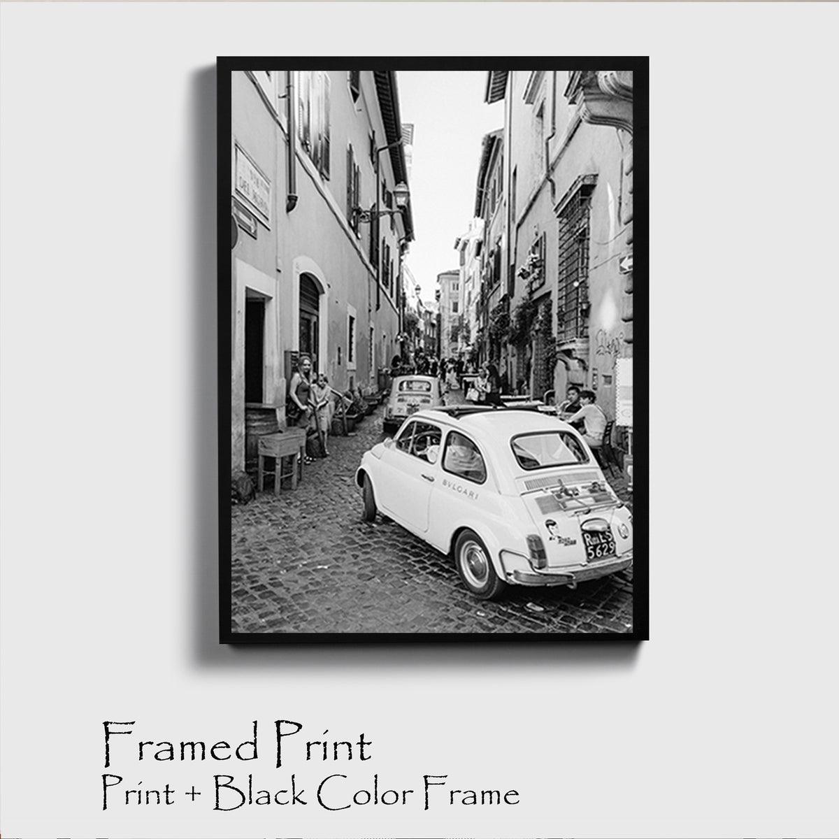 Narrow street near the Spanish Steps with the famous little car Fiat 500.