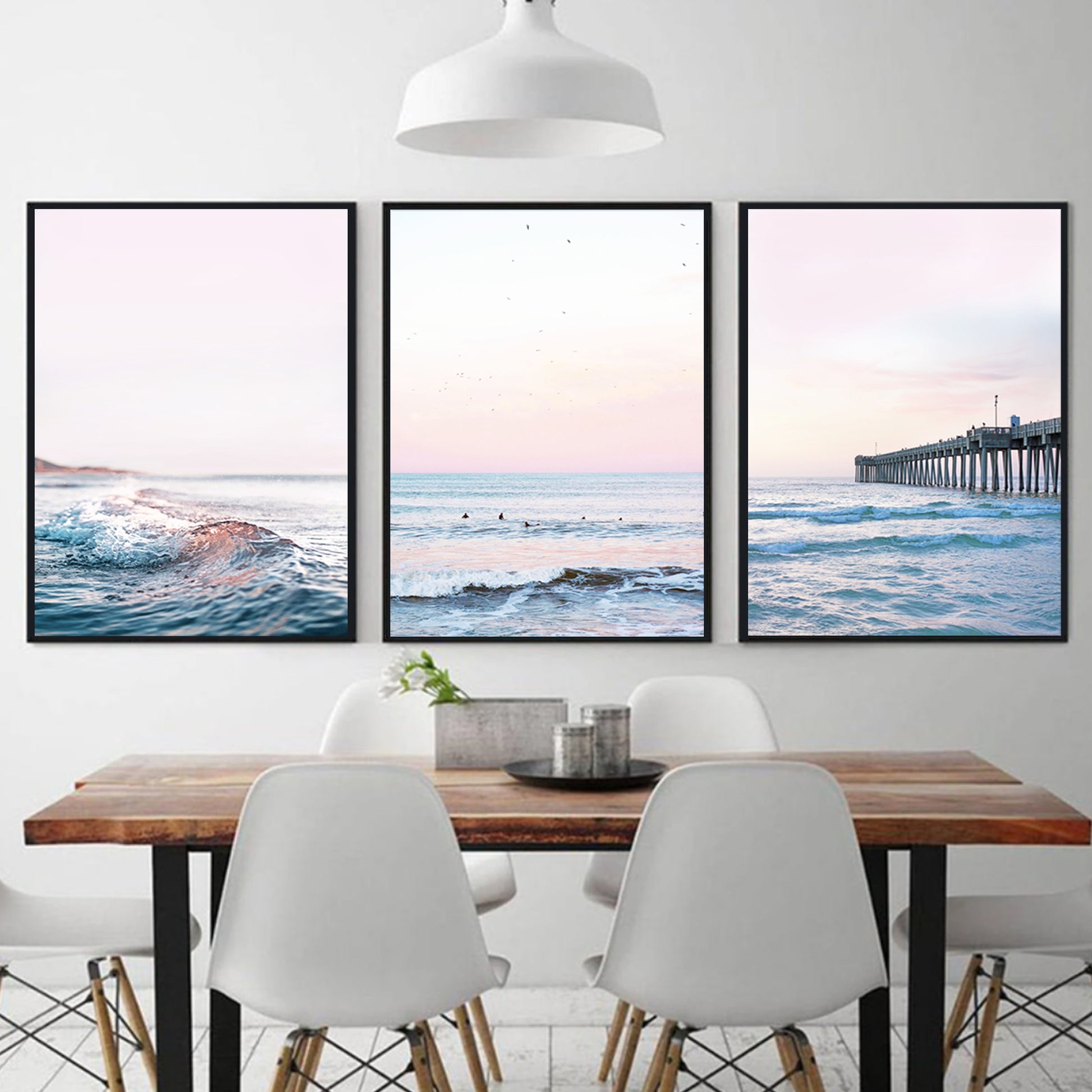 Coastal triptych wall art in black color frames.