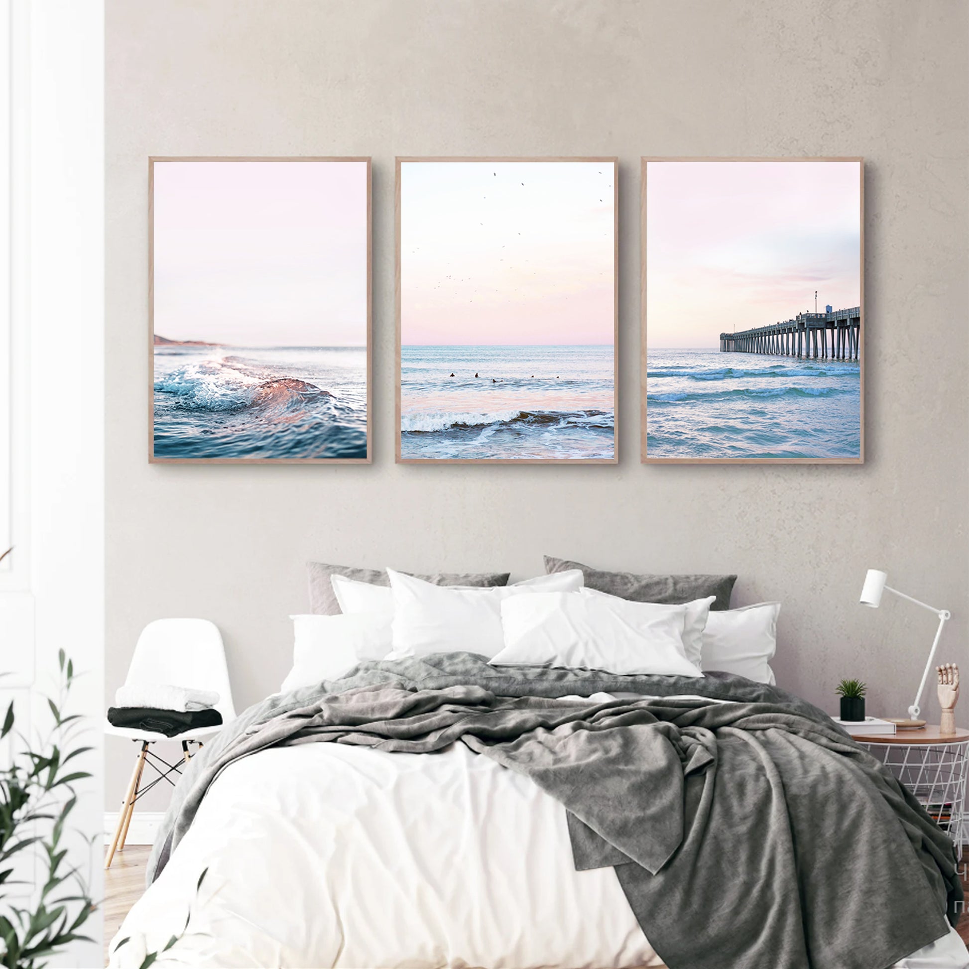 Coastal triptych wall art in bedroom.