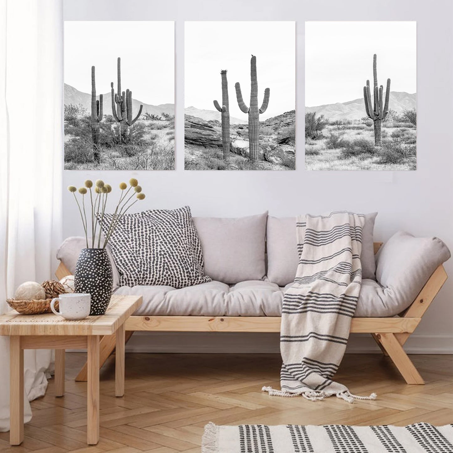 Stretched canvas triptych with cacti.