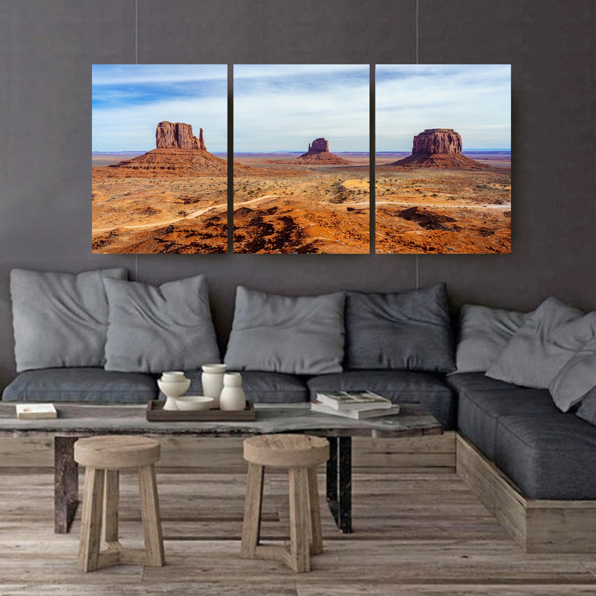 Canvas prints on dark wall.