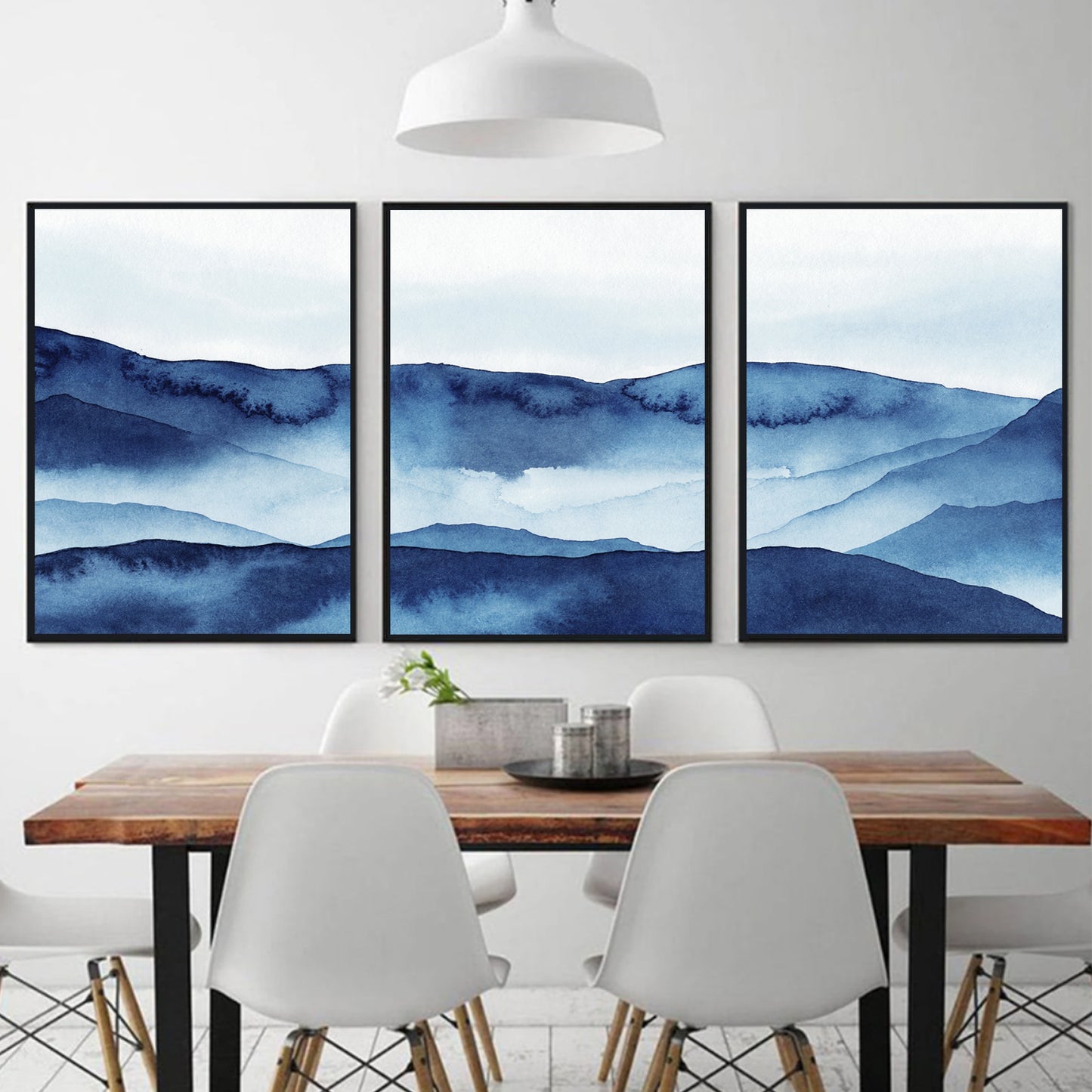 Blue mountain triptych in black color frames.