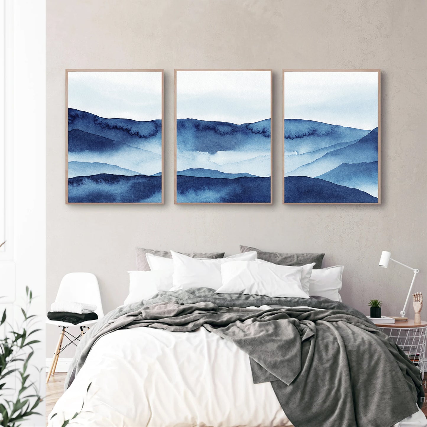 Blue mountain wall art in bedroom.