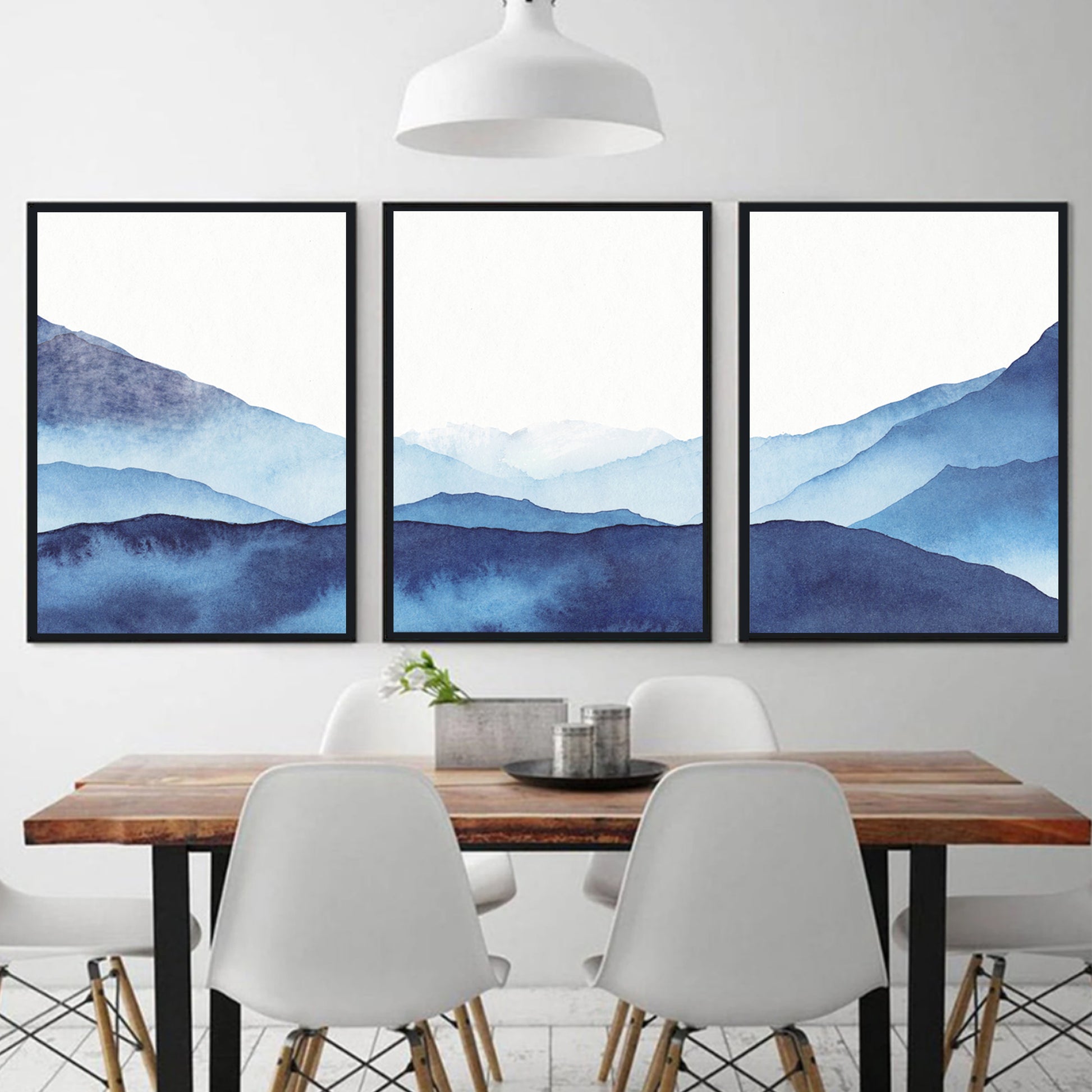 Abstract watercolor print with blue mountain in black color frames.