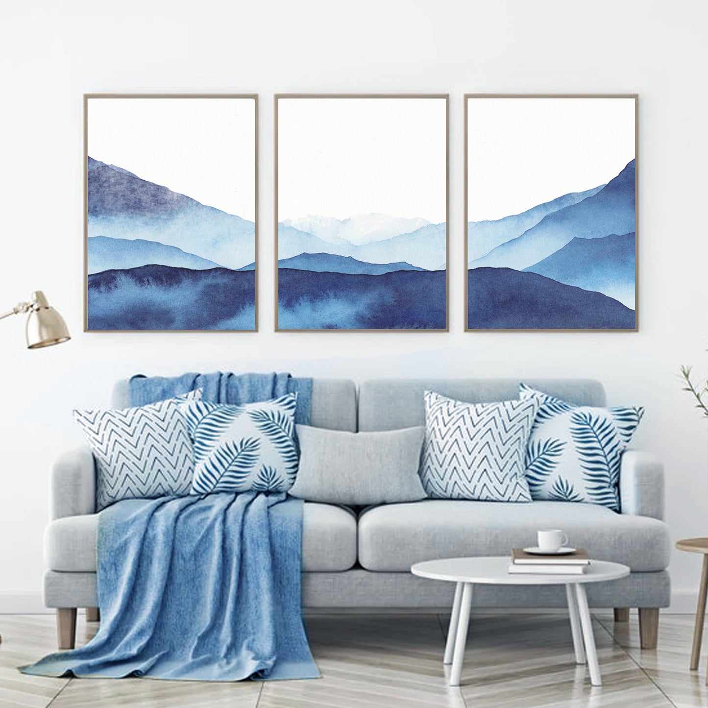 Abstract watercolor prints above the sofa.