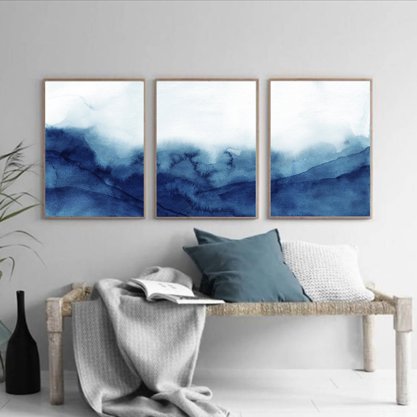 Rolling ocean wave triptych in wood color frames.