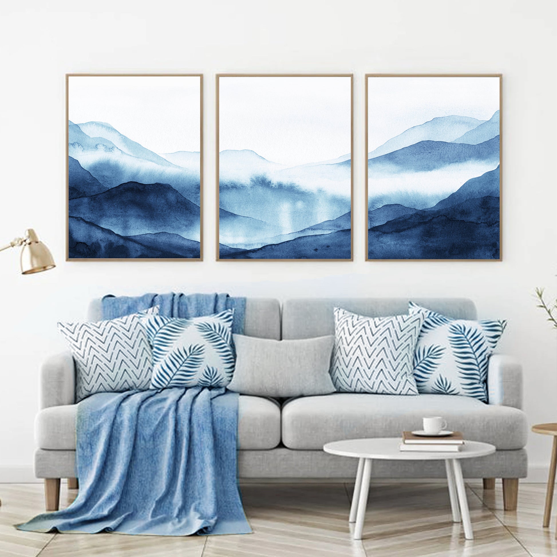 Blue mountains triptych above the sofa.