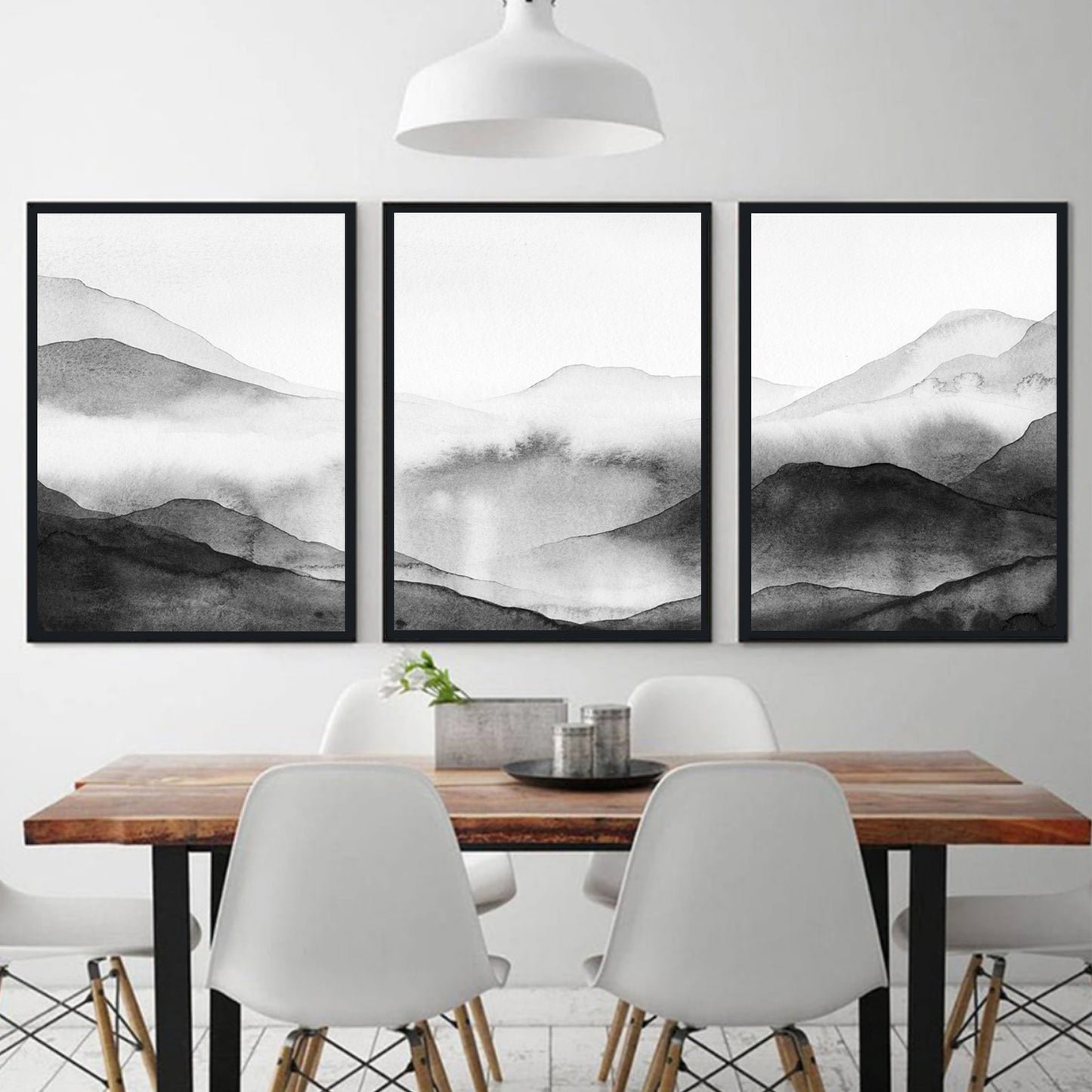 Watercolor mountain valley wall art in black color frames.